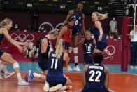 United States players celebrate winning the women's volleyball semifinal match between Serbia and United States at the 2020 Summer Olympics, Friday, Aug. 6, 2021, in Tokyo, Japan. (AP Photo/Frank Augstein)