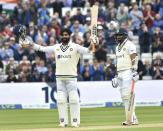 India's Ravindra Jadeja, left, celebrates after reaching a century during the second day of the fifth cricket test match between England and India at Edgbaston in Birmingham, England, Saturday, July 2, 2022. (AP Photo/Rui Vieira)