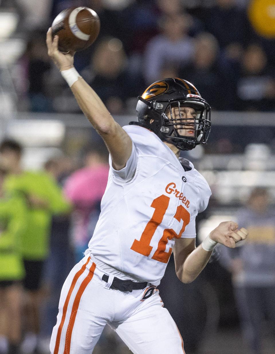 Green quarterback Tyson Hunka fires a pass against Perry at Perry Friday, October 6, 2023.