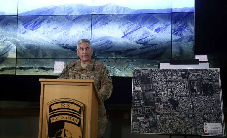 General John F. Campbell, Commander of U.S. and NATO forces in Afghanistan, stands beside a map of Kunduz as he addresses a press conference in Kabul on November 25, 2015 on the deadly air strike on an MSF hospital