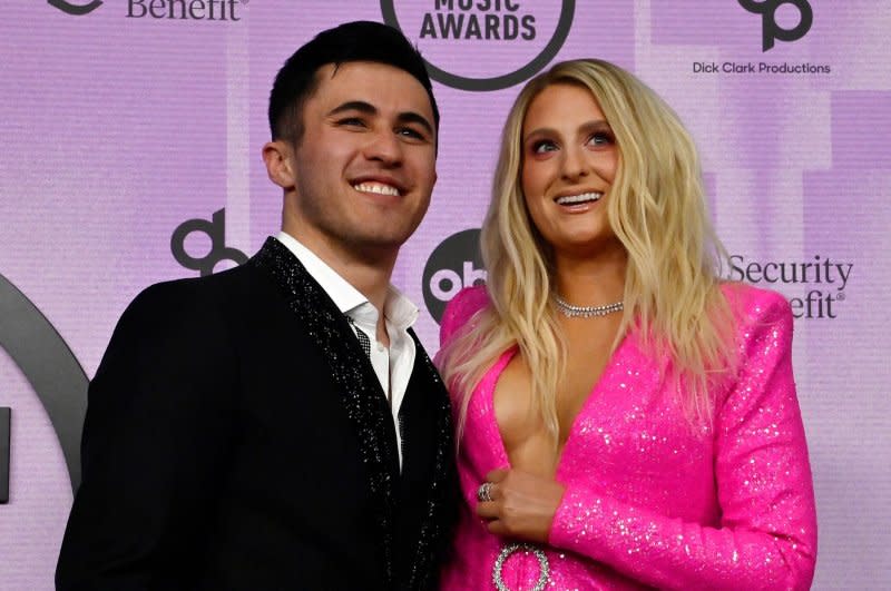 Meghan Trainor (R) and Chris Olsen attend the American Music Awards in 2022. File Photo by Jim Ruymen/UPI
