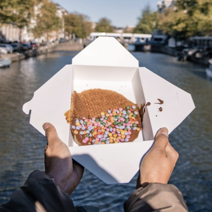 Someone holding a stroopwafel