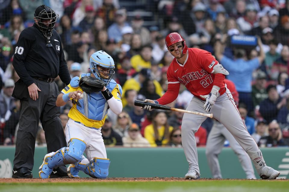Los Angeles Angels' Mike Trout (27) reacts after striking out on a foul tip to Boston Red Sox's Reese McGuire (not shown) during the fifth inning of a baseball game, Saturday, April 13, 2024, in Boston. (AP Photo/Michael Dwyer)