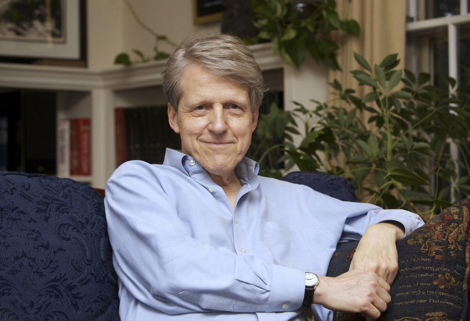 Robert Shiller, one of three American scientists who won the 2013 economics Nobel prize, poses at his home in New Haven