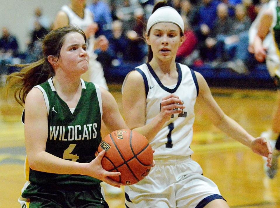 Northwestern's Tara Blachford (4) drives against Great Plains Lutheran's Halle Bauer during a high school basketball doubleheader on Thursday, Feb. 9, 2023 in Watertown.