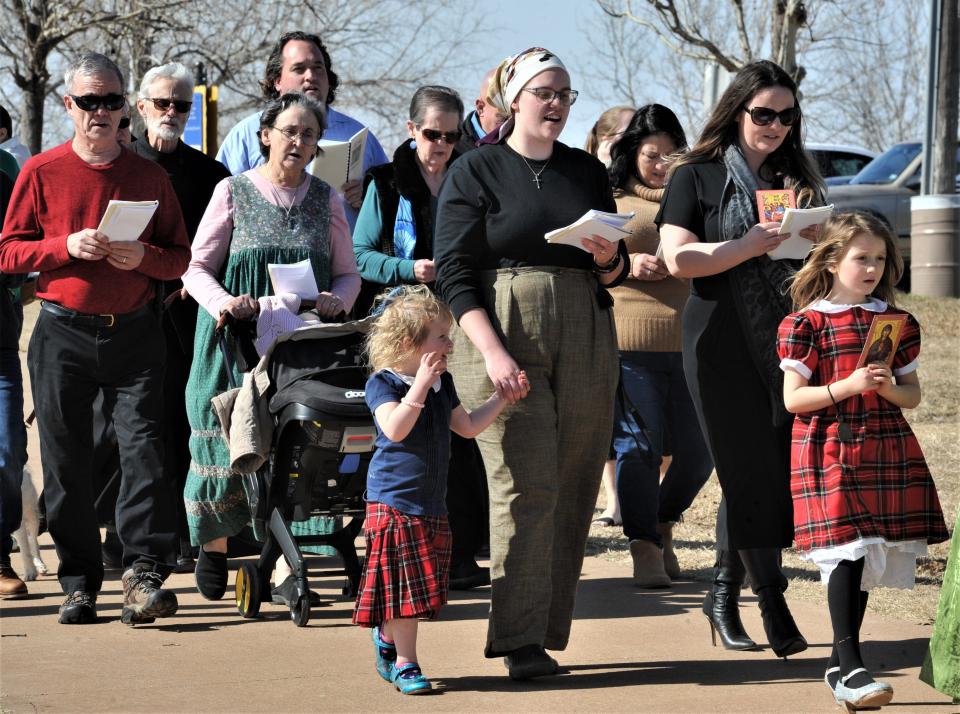 Church and community members join in song during the Saint Benedict Orthodox Church blessing ceremony at Lake Wichita.