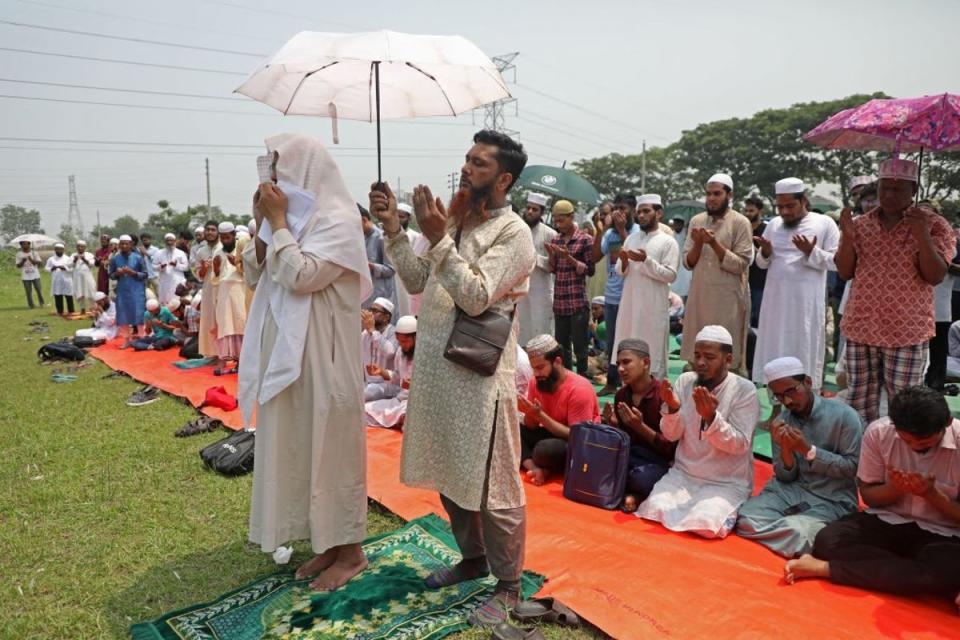 Hundreds of Muslims congregated at an open field in central Dhaka on April 17 to offer special prayers for rains as a heatwave swept the country (AFP via Getty Images)