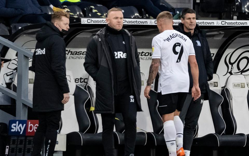 Derby County's Martyn Waghorn walks off past caretaker manager Wayne Rooney after being dismissed for a tackle on Preston North End's Alan Browne during the Sky Bet Championship match between Derby County and Preston North End  - GETTY IMAGES