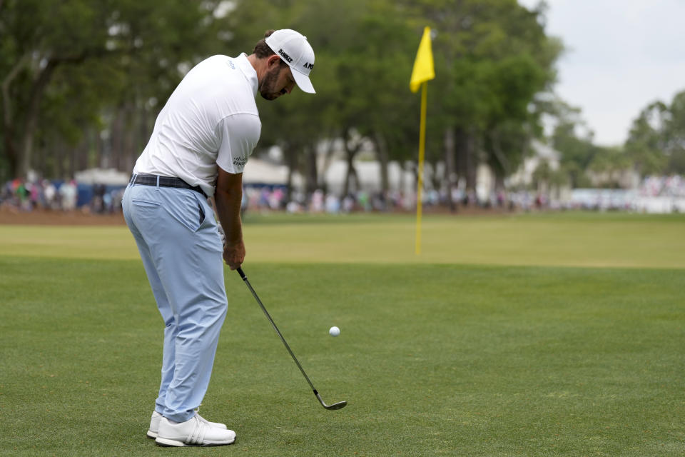 Patrick Cantlay chips to the green on the first hole during the final round of the RBC Heritage golf tournament, Sunday, April 21, 2024, in Hilton Head Island, S.C. (AP Photo/Chris Carlson)