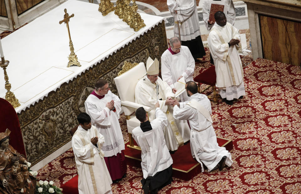 Pope Francis blesses a new priest during an ordination ceremony in St. Peter's Basilica at the Vatican, Sunday, May 12, 2019. (Giuseppe Lami/Pool Photo Via AP)