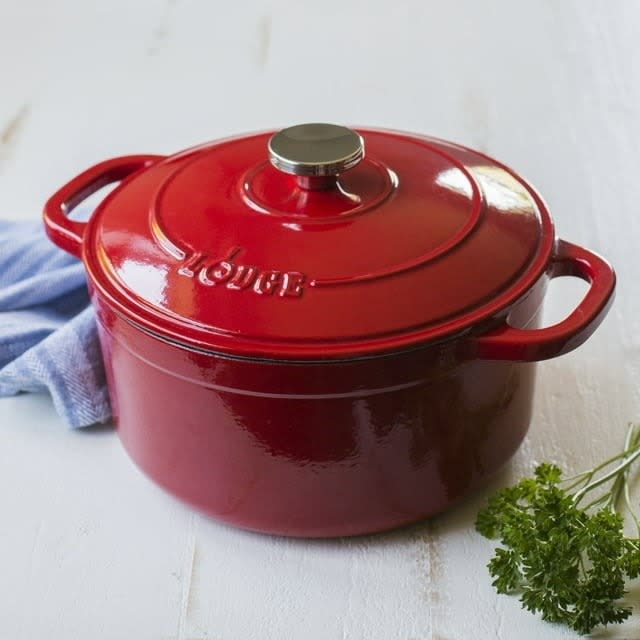 the red dutch oven on a table