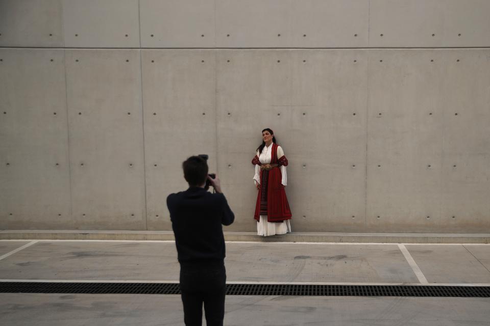 Greek soprano Artemis Bogri poses for the photographer Andreas Simopoulos before a rehearsal of "Despo-Greek Dances" Opera and dance performance in Athens, Thursday, March 4, 2021. Dozens of museum exhibitions, theater productions, discussion panels and historical re-enactments were planned in Greece for this year to commemorate the bicentennial of the 1821-1832 Greek War of Independence. But due to the coronavirus pandemic, mezzo-soprano Artemis Bogri and her fellow singers stepped onstage in an empty theater to perform the Greek National Opera’s new production of “Despo,” one of the events marking 200 years since the war that resulted in Greece’s independence from the Ottoman Empire and rebirth as a nation. (AP Photo/Thanassis Stavrakis)