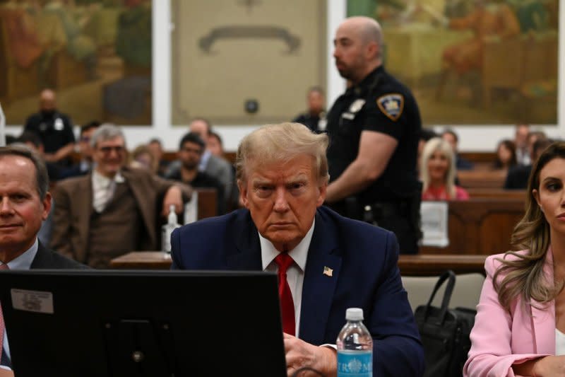 Former President Donald Trump appears in the courtroom at the State Supreme Court on December 7 in New York City. Photo by Louis Lanzano/UPI