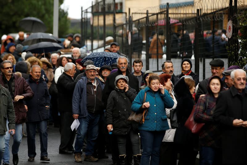 People wait in line to submit their petitions opposing a massive canal project in Istanbul