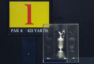 FILE - In this Sunday, July 21, 2019 file photo protected by a glass case the famous Claret Jug stands on the 1st tee the British Open Golf Championships at Royal Portrush in Northern Ireland. The organizers of the British Open announced Monday April 6, 2020, that they have decided to cancel the event in 2020 due to the current Covid-19 pandemic and that the Championship will next be played at Royal St George's in 2021. (AP Photo/Matt Dunham)