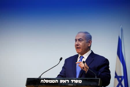Israeli Prime Minister Benjamin Netanyahu gestures as he delivers a statement at the Knesset, Israel's parliament, in Jerusalem December 19, 2018. REUTERS/Amir Cohen