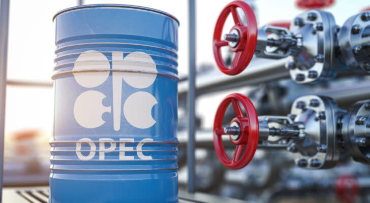 Organization of the Petroleum Exporting Countries (OPEC) logo displayed on baby blue oil barrel next to red valve with steel pipes in background