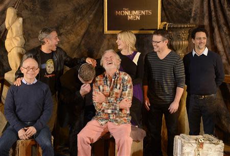 Cast members (L-R) Bob Balaban, George Clooney, John Goodman, Bill Murray, Cate Blanchett, Matt Damon and Grant Heslov laugh during a photo call for the film "The Monuments Men" held in Beverly Hills January 16, 2014. REUTERS/Phil McCarten