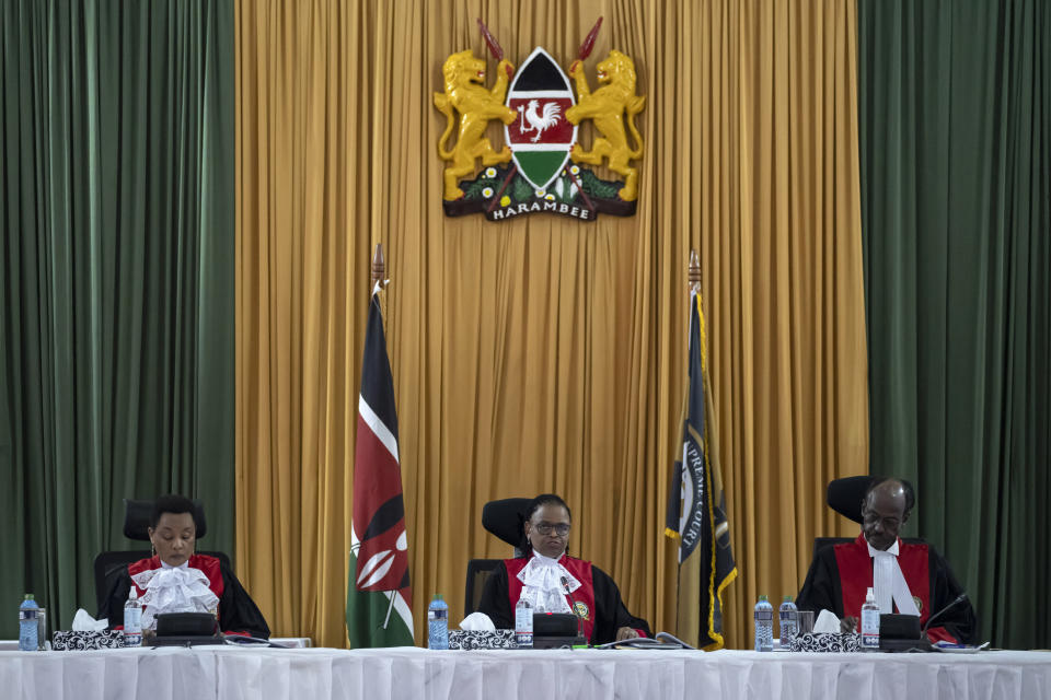 From left to right, Kenya's Supreme Court judges Deputy Chief Justice Philomena Mbete Mwilu, Chief Justice Martha Koome, and Mohammed Khadhar Ibrahim, deliver judgement in the electoral petition at the Supreme Court in Nairobi, Kenya Monday, Sept. 5, 2022. Kenya's Supreme Court on Monday is ruling on challenges to the presidential election in which Deputy President William Ruto was declared the winner by a slim margin and opposition candidate Raila Odinga alleged irregularities in the otherwise peaceful Aug. 9 election. (AP Photo/Ben Curtis)