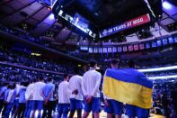 Creighton's Rati Andronikashvili, right, and Modestas Kancleris second from right, wear a flag of Ukraine before an NCAA college basketball game against Villanova in the final of the Big East conference tournament Saturday, March 12, 2022, in New York. (AP Photo/Frank Franklin II)