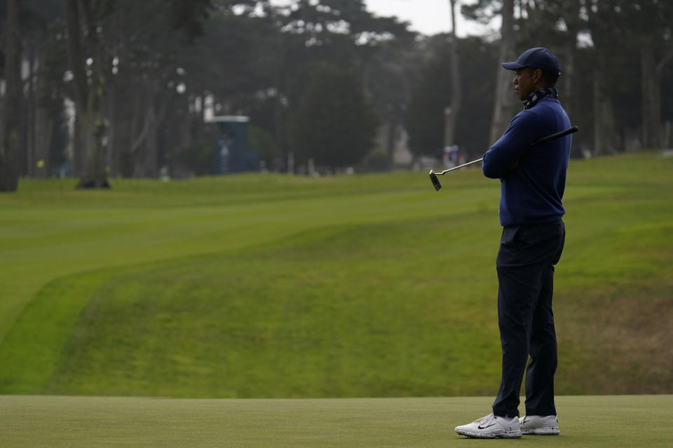 Tiger Woods waits to putt on the 15th hole with no gallery in the fairway behind him during the first round of the PGA Championship golf tournament at TPC Harding Park Thursday, Aug. 6, 2020, in San Francisco. (AP Photo/Jeff Chiu)