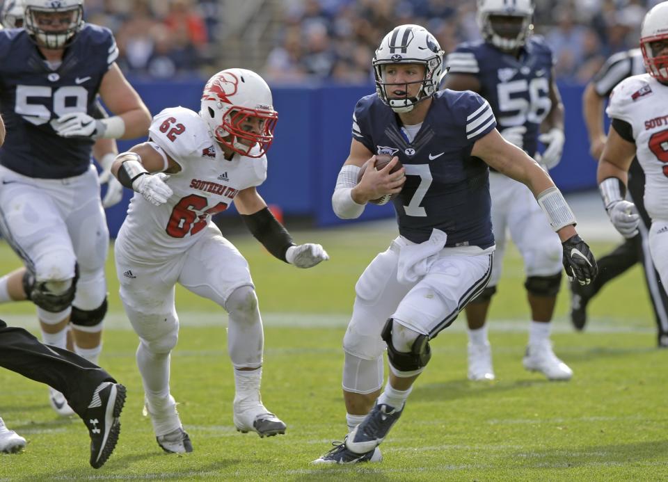 BYU QB Taysom Hill has thrown for 2,323 yards, rushed for 603 yards and combined for 20 TDs this season. (AP Photo/Rick Bowmer)