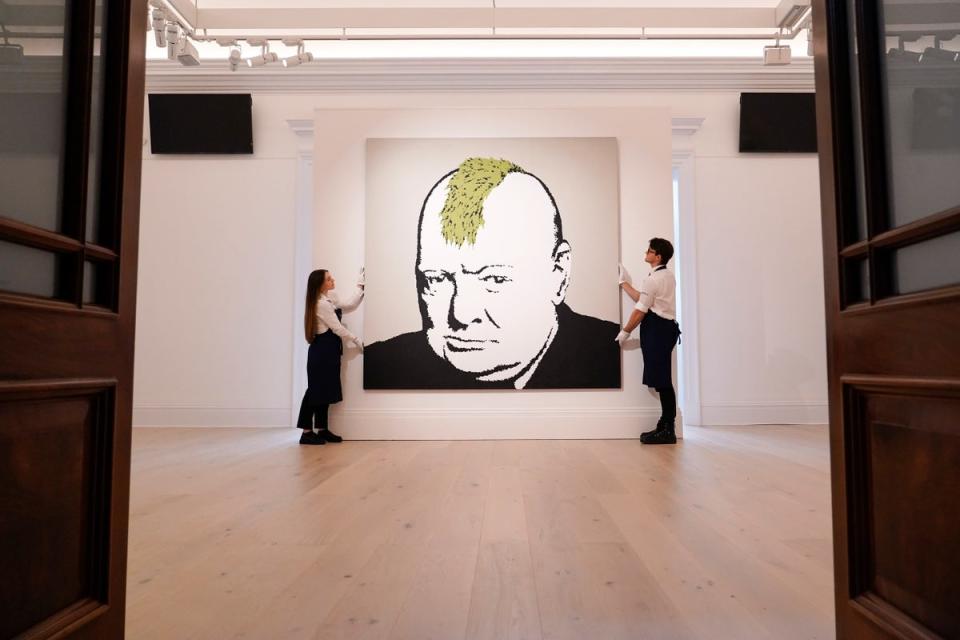 Winston Churchill depicted with a lime green mohican in Banksy’s 2003 exhibition in London called Turf War (Copyright 2022 The Associated Press. All rights reserved)