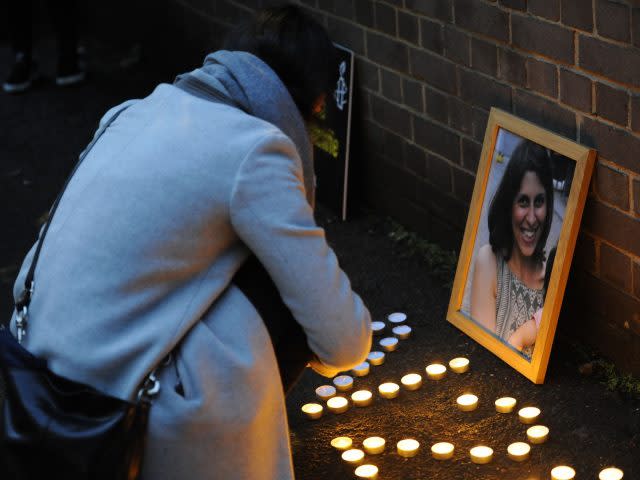 A woman lights candles at a vigil held for Nazanin Zaghari-Ratcliffe (Kirsty O'Connor/PA)