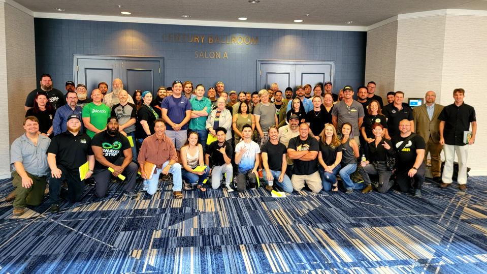 Reptile keepers gather for a picture at the Florida Fish and Wildlife Commission meeting at the Hilton University of Florida Conference Center in Gainesville on Tuesday, May 3.