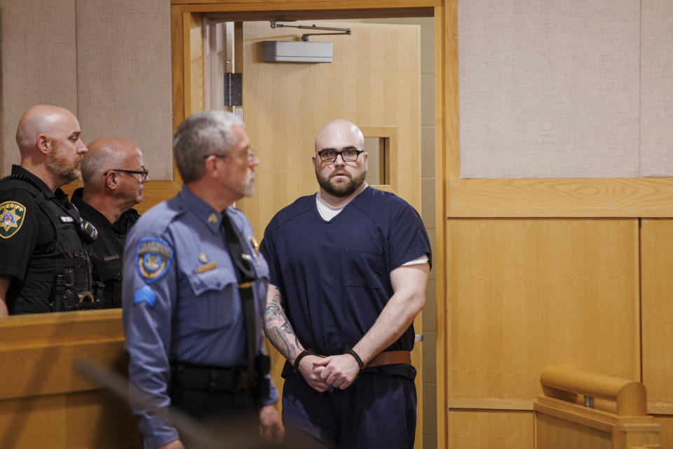 Joseph Eaton walks into a courtroom at West Bath District Court for his arraignment on Friday, July 28, 2023. Eaton, who told police he killed his parents and their friends and shot at motorists on a busy interstate highway might try to show he was insane, based on pleas he entered Friday. The 34-year-old ex-convict Joseph Eaton entered pleas of both not guilty and not criminally responsible, leaving him the option of an insanity defense against charges including four counts of murder.(Brianna Soukup/Portland Press Herald via AP, Pool)