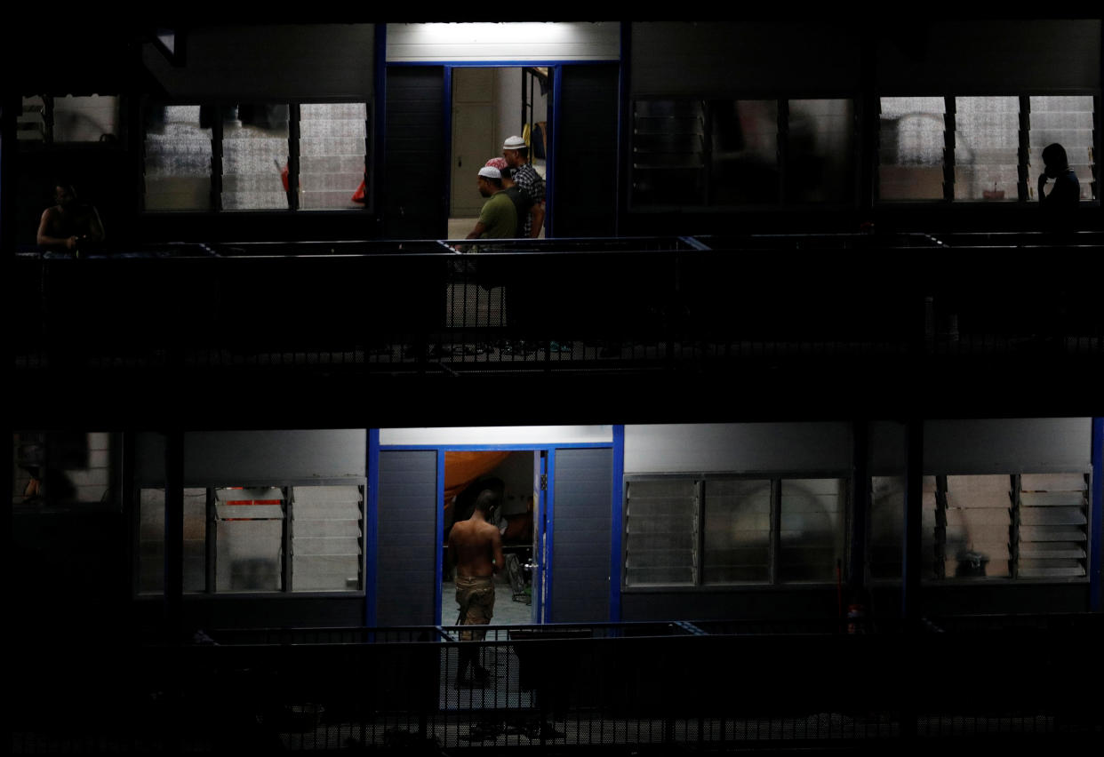 Migrant workers pray during the holy month of Ramadan in their dormitory room, amid the outbreak here on 4 May, 2020. (PHOTO: Reuters)