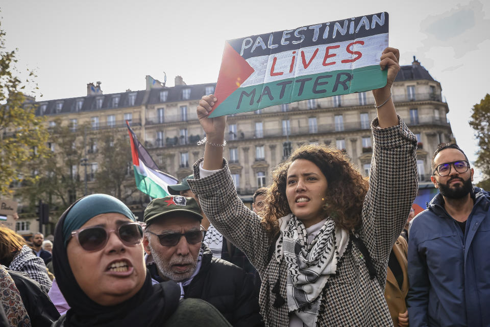 Protesters take part during a demonstration organized by the "National Collective for a just and lasting peace between Palestinians and Israelis" in Paris, Sunday, Oct. 22, 2023. (AP Photo/Aurelien Morissard)