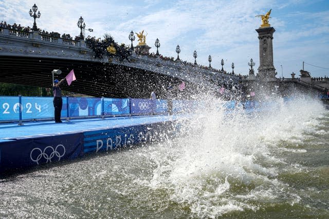 Triathletes dive into the Seine