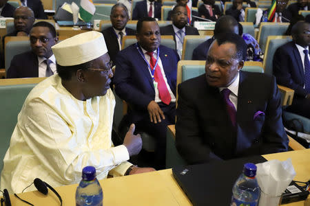 President of Chad Idriss Deby talks to Republic of the Congo President Denis Sassou Nguesso during the High Level Consultation Meetings of Heads of State and Government on the situation in the Democratic Republic of Congo at the African Union Headquarters in Addis Ababa, Ethiopia January 17, 2019. REUTERS/Tiksa Negeri