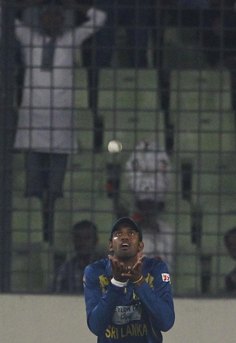 Sri Lanka’s Sachithra Senanayake prepares to make a catch to dismiss Bangladesh’s Shakib Al Hasan during their second one-day international (ODI) cricket match in Dhaka, Bangladesh, Thursday, Feb. 20, 2014. (AP Photo/A.M. Ahad)