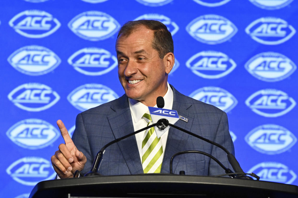 ACC commissioner Jim Phillips smiles during a college football news conference on Monday. (AP Photo/Matt Kelley)