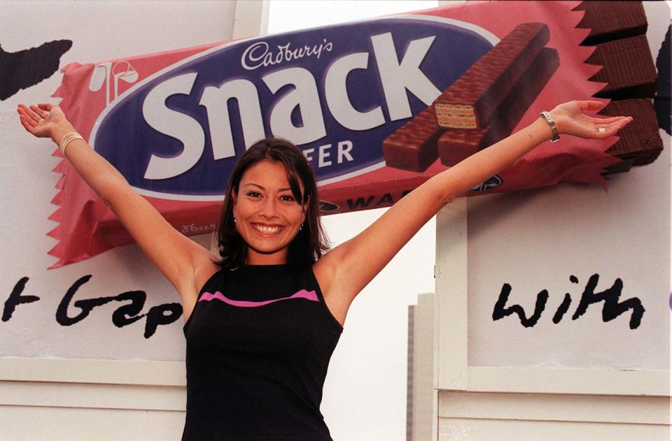 Big Breakfast star Melanie Sykes launches Cadbury's latest bar the Snack Wafer with a 12 foot long, 30 times magnification of the biscuit on a billboard in London today (Thursday). Photo by Tony Harris/PA. (Photo by Tony Harris - PA Images/PA Images via Getty Images)