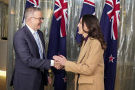 New Zealand Prime Minister Jacinda Ardern, right, is greeted by Australian Prime Minister Anthony Albanese ahead of a bilateral meeting in Sydney, Australia, Friday, June 10, 2022. Ardern is on a two-day visit to Australia. (AP Photo/Mark Baker, Pool)