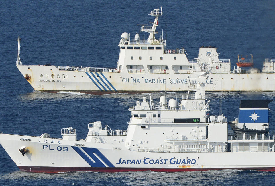 FILE - Ships of China Marine Surveillance and Japan Coast Guard steam side by side near disputed islands, called Senkaku in Japan and Diaoyu in China, in the East China Sea, Oct. 25, 2012. Japan and China on Thursday, Sept. 29, 2022, mark the 50th anniversary of the 1972 normalization of their ties, but there isn't much of a celebratory mood. Improved ties between Asia’s two biggest economies are considered vital to the region's stability and prosperity, but they remain at odds over disputed East China Sea islands and China’s growing military and economic assertiveness in the region. (Kyodo News via AP, File)