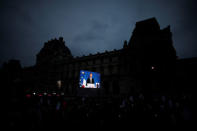 President Elect Emmanuel Macron is seen on a giant screen near the Louvre museum after results were announced in the second round vote of the 2017 French presidential elections, in Paris, France May 7, 2017. REUTERS/Benoit Tessier