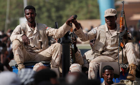 Sudanese soldiers are seen on their vehicles as they move with a military convoy outside the defense ministry compound in Khartoum, Sudan, April 25, 2019. REUTERS/Umit Bektas