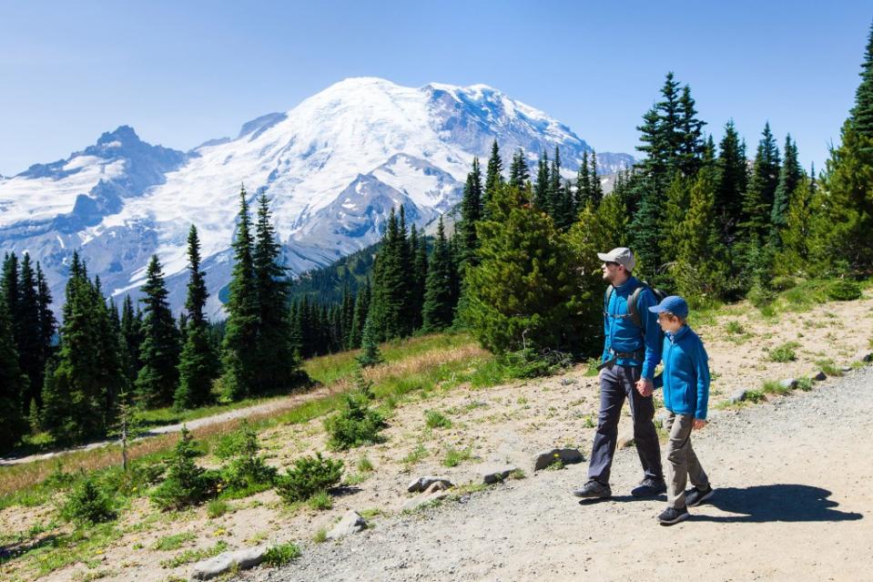 A father and son enjoy Mount Rainier, No. 10 on the list. Aleksei Potov – stock.adobe.com