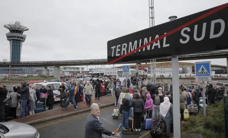 Passengers evacuated from Orly airport southern terminal after a shooting incident near Paris, France March 18, 2016. REUTERS/Benoit Tessier