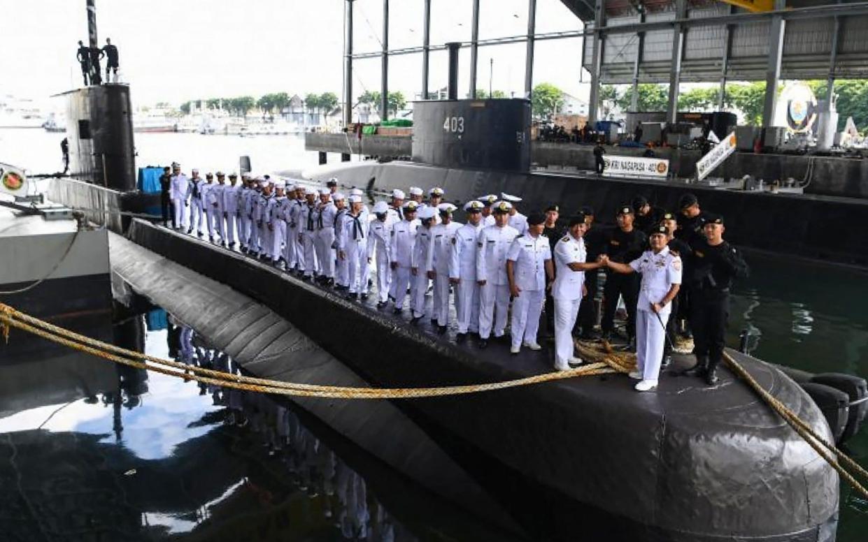 This handout from the Indonesia military taken on February 20, 2019 and released on April 21, 2021 shows the crew and officers during a ceremony onboard the Indonesian Cakra class submarine KRI Nanggala  - AFP