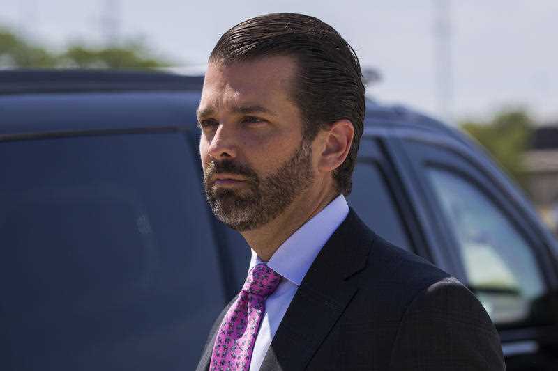 Donald Trump Jr., the son of President Donald Trump, steps off Air Force One with President Donald Trump as they arrive at General Mitchell International Airport.