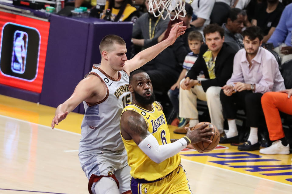 LOS ANGELES, CA - MAY 22: Los Angeles Lakers forward LeBron James (6) gets past Denver Nuggets center Nikola Jokic (15) during the Denver Nuggets versus the Los Angeles Lakers in Game 4 of the NBA Western Conference Finals on May 22, 2023, at Crypto.com Arena in Los Angeles, CA. (Photo by Jevone Moore/Icon Sportswire via Getty Images)