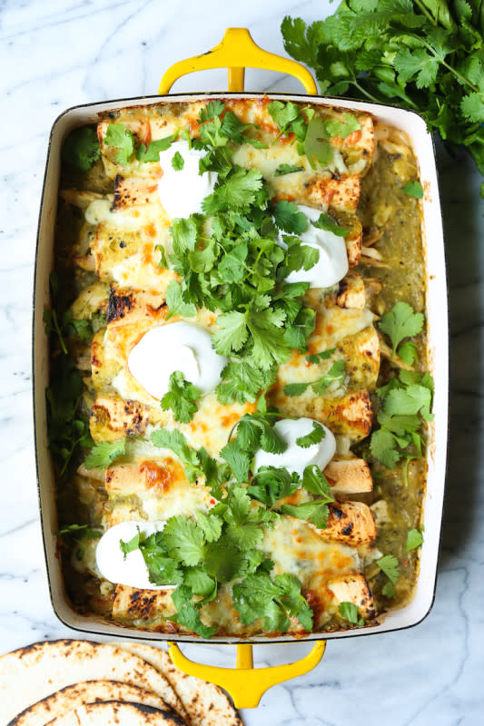 <p>Salsa verde, green chiles, leftover rotisserie chicken and Monterey Jack cheese make for the best weeknight enchiladas ever!</p><p><strong>Get the recipe: <a href="https://damndelicious.net/2019/03/01/green-chicken-enchiladas/" rel="nofollow noopener" target="_blank" data-ylk="slk:Green Chicken Enchiladas;elm:context_link;itc:0;sec:content-canvas" class="link "><em>Green Chicken Enchiladas</em></a></strong></p>