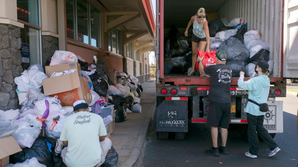 PHOTO: Volunteers unload donated goods at a food and supply distribution center in Lahaina, Hawaii, Aug. 17, 2023. (Jae C. Hong/AP)