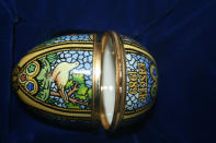Royal presentation Halcyon Days enamel Easter egg box decorated with stained glass-effect animal scenes and the words 'Easter 1989' is accompanied with its original gift bag, inscribed by Princess Diana - 'To Fay, wishing you a very happy Easter and lots of love from Diana' (Reeman Dansie)