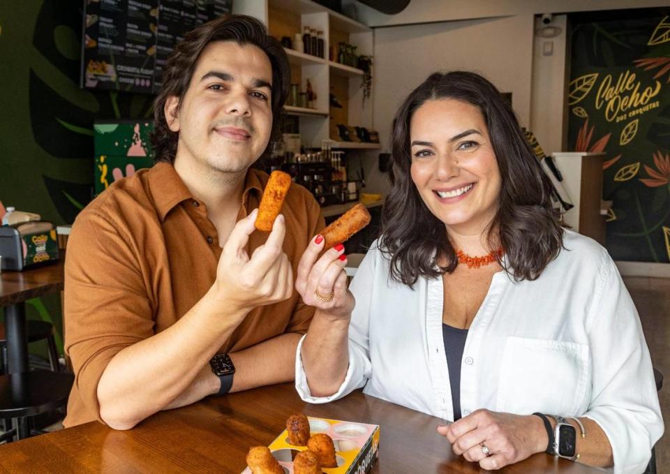 Alec Fernandez and Vicky Carballo, owners of Dos Croquetas, with some of their favorite croquetas. The crowd favorite is the 305, with piccadillo, sweet plantains and queso blanco.